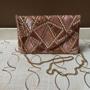 Chic pink and bronze clutch with chain